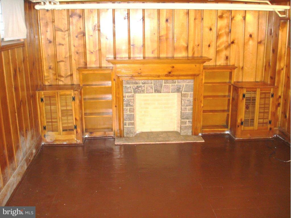 823 Kevin Road Baltimore, MD 21229 - Photo 3 of 12 a view of an empty room with a window