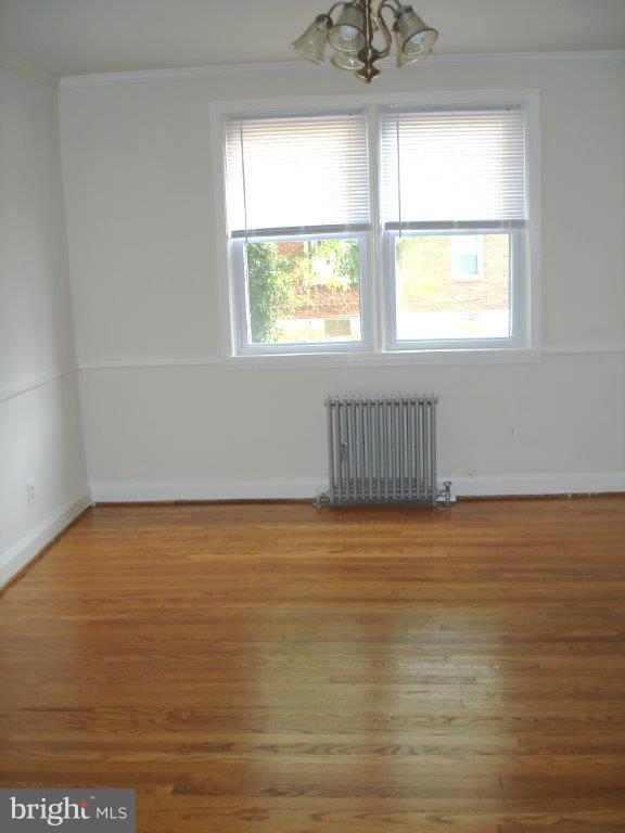 823 Kevin Road Baltimore, MD 21229 - Photo 5 of 12 a view of an empty room with a window