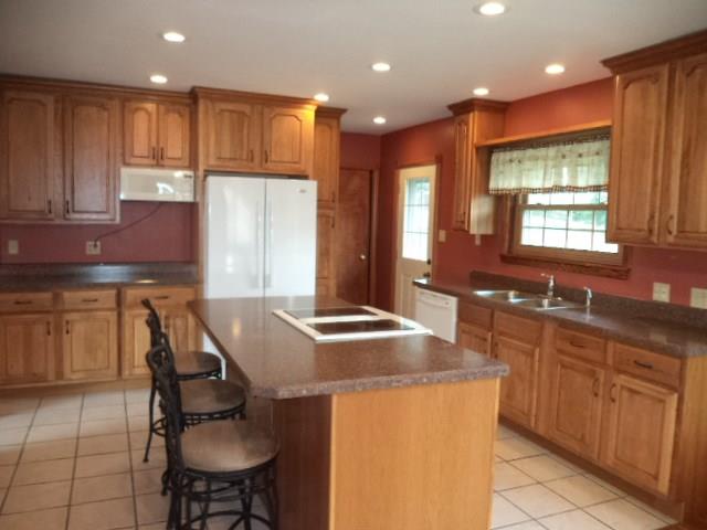 33 Darlington Road Beaver Falls, PA 15010 - Photo 11 of 17 Kitchen with newer cabinets, countertops and ceramic tile flooring
