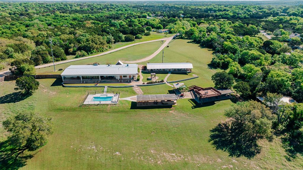 175 Tobacco Road Whitney, TX 76692 - Photo 33 of 35 Drone / aerial view of a heavily wooded area