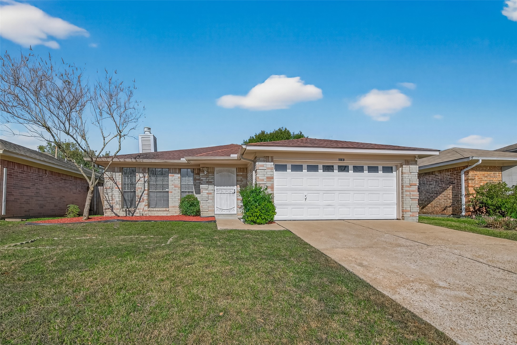 Curb appeal meets comfort at 10810 Umber Court! This move-in-ready home features a four-sided brick exterior, offering both lasting durability and a classic look. The front yard shines with a manicured lawn and fresh, vibrant landscaping. You’ll love the modern touch of the windowed garage door and the clean, inviting entryway. Designed for low-maintenance living without sacrificing style, this Houston gem is ready for its next chapter. Schedule your tour today!