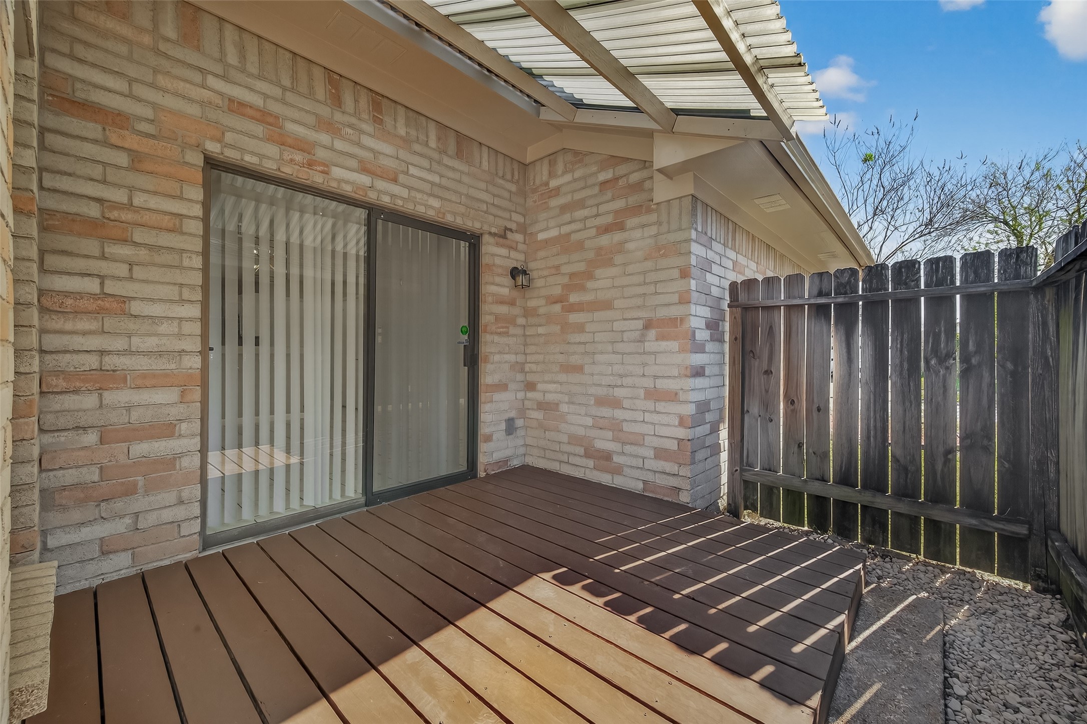 10810 Umber Court Houston, TX 77099 - Photo 37 of 43 Step outside to your private outdoor retreat, featuring a spacious deck that is perfect for a quiet morning coffee. The deck is framed by a sturdy privacy fence, ensuring a secluded atmosphere for you and your guests.