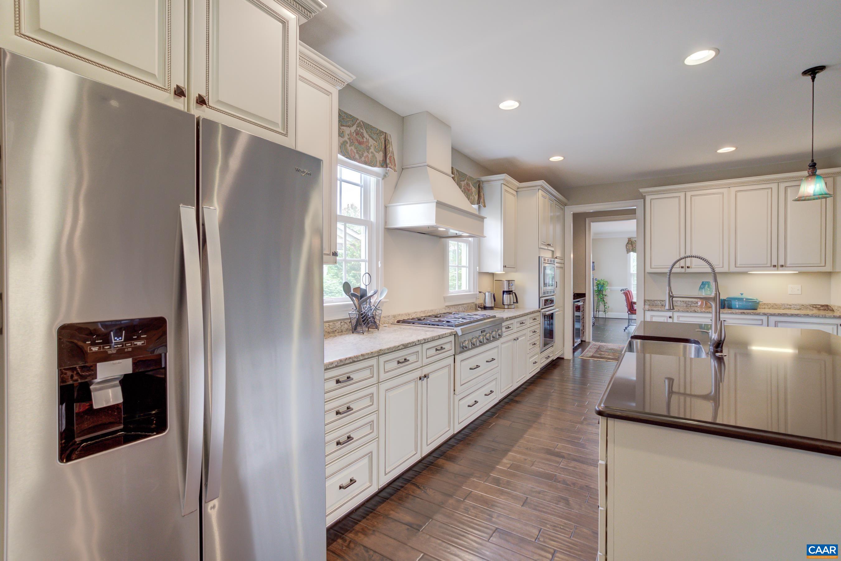 5129 Brook View Road Crozet, VA 22932 - Photo 16 of 71 a kitchen with white cabinets and refrigerator