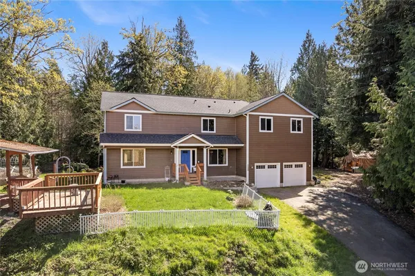a front view of a house with a yard table and chairs