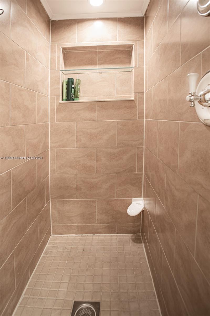 1531 Moffett Street Hollywood, FL 33020 - Photo 20 of 34 a bathroom with a shower