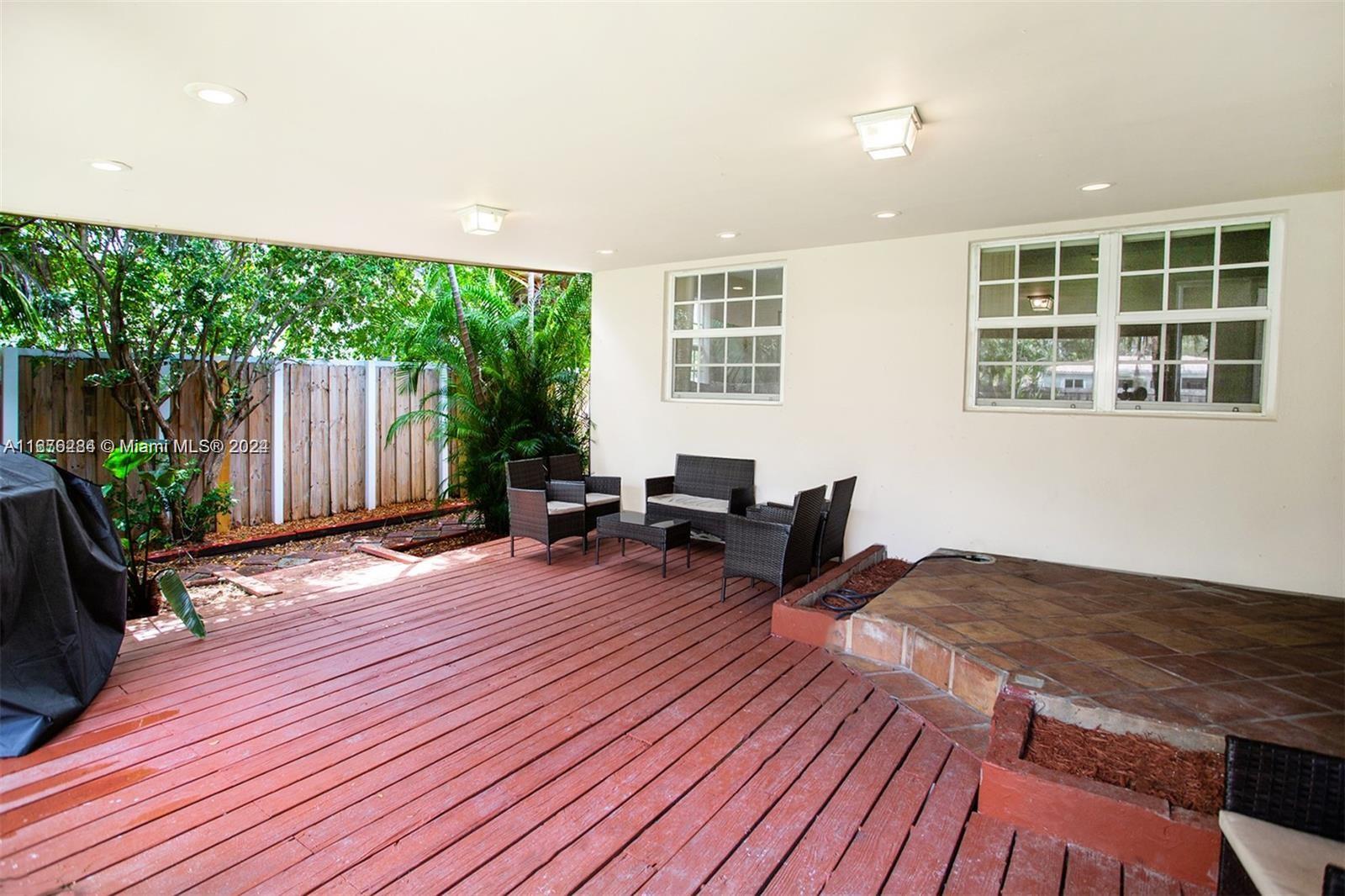 1531 Moffett Street Hollywood, FL 33020 - Photo 28 of 34 a view of a patio with wooden floor