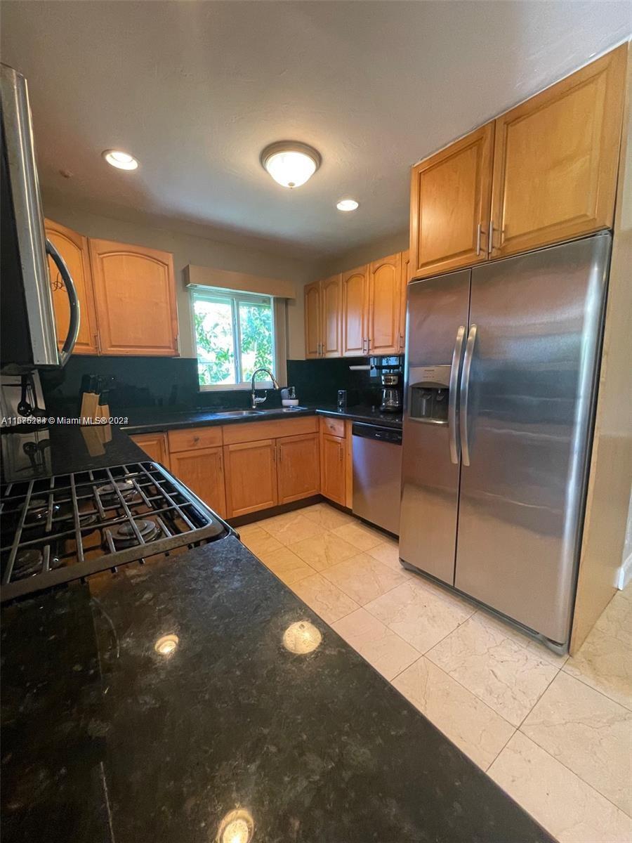 1531 Moffett Street Hollywood, FL 33020 - Photo 3 of 34 a kitchen with stainless steel appliances a sink stove and refrigerator