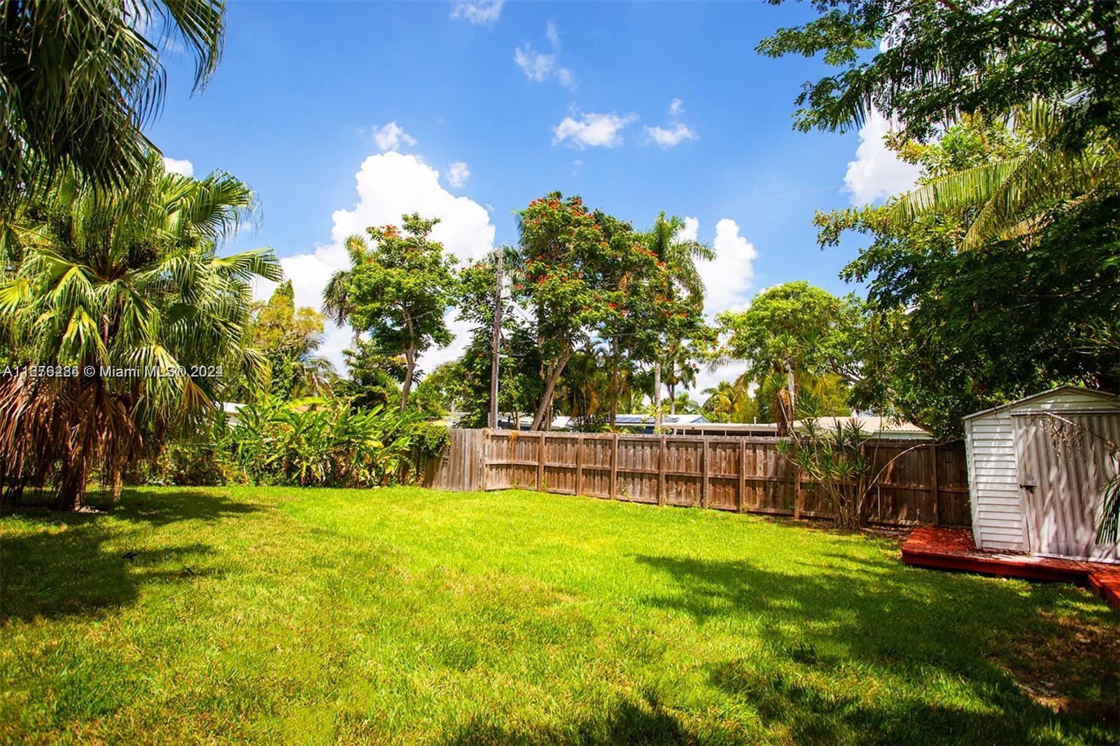 1531 Moffett Street Hollywood, FL 33020 - Photo 33 of 34 a view of yard with swimming pool and green space