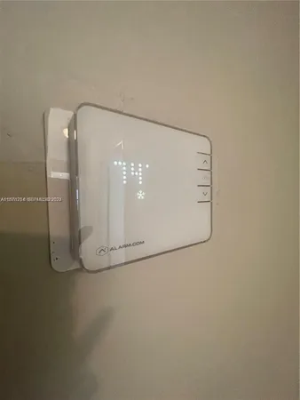 a room with a sink and a mirror