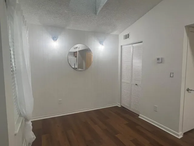 a view of a livingroom with wooden floor