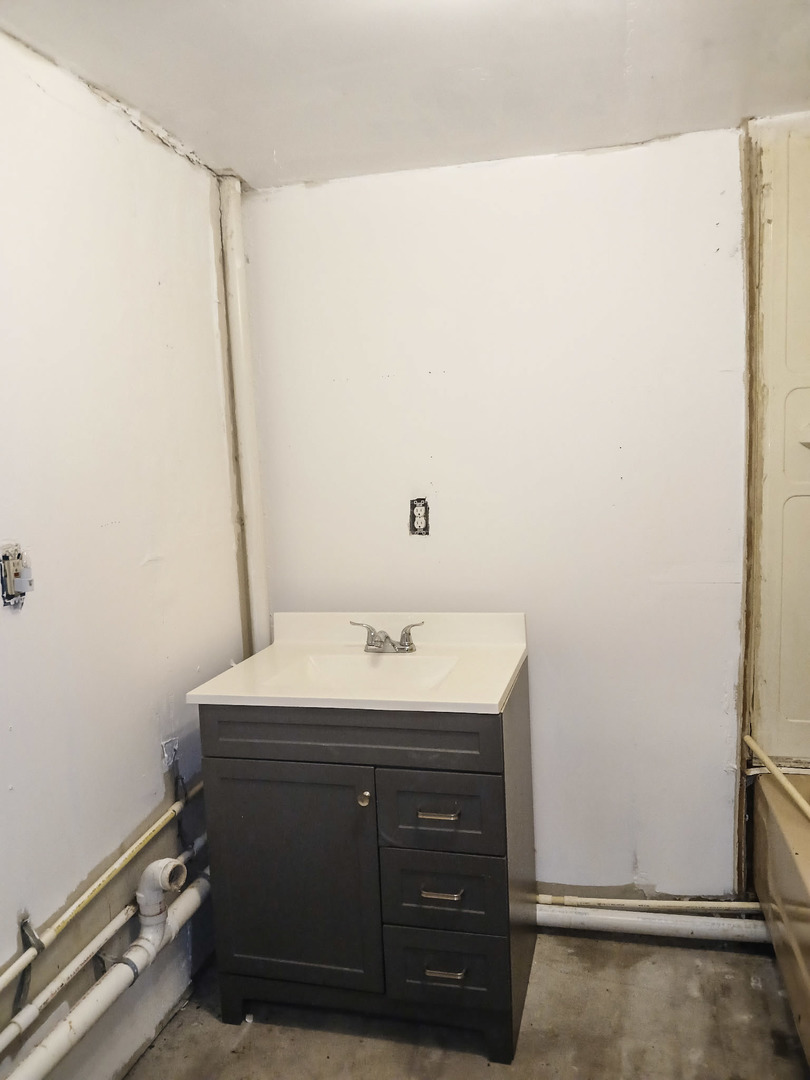 2112 East 2400 North Road Watseka, IL 60970 - Photo 12 of 13 a bathroom with a sink and a mirror