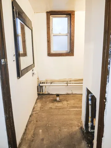 a view of a bathroom with a sink and a window
