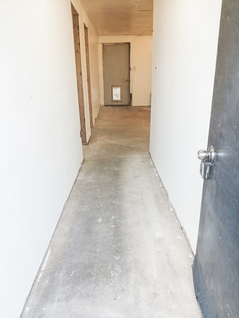 2112 East 2400 North Road Watseka, IL 60970 - Photo 7 of 13 a view of a hallway with wooden floor