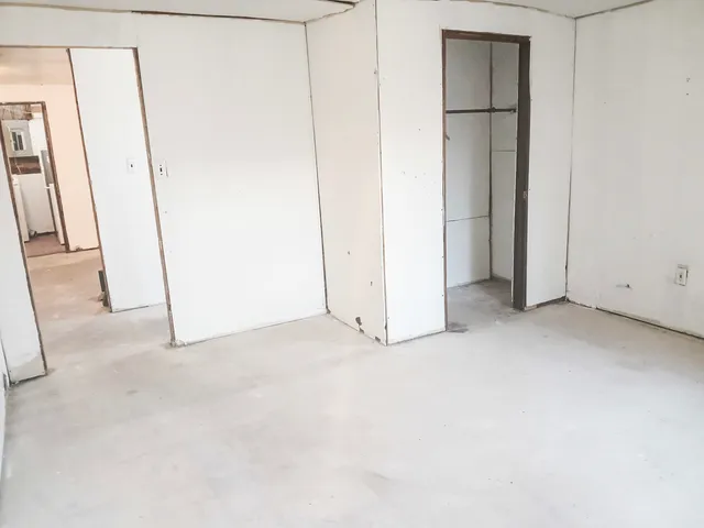 an empty room with windows