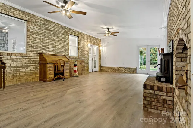 a spacious bedroom with a bed and a dresser