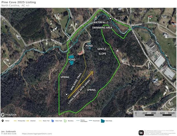 a wooden fence with a view of mountains in the background