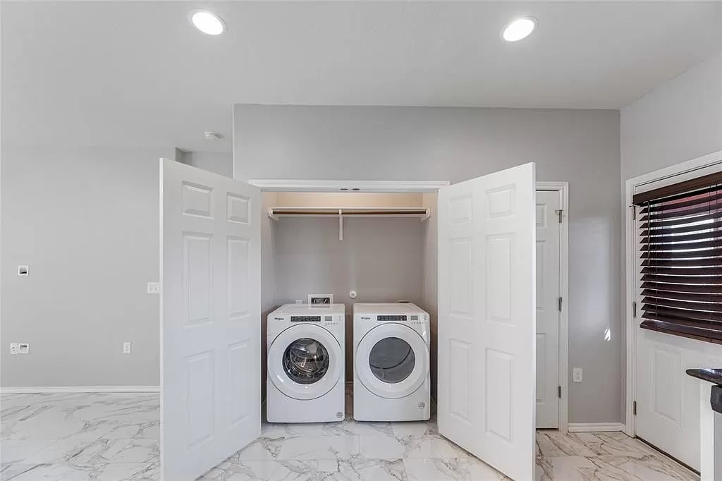 13021 Foreston Drive Austin, TX 78754 - Photo 14 of 17 Laundry area with light marble finish flooring, washing machine and dryer, and recessed lighting
