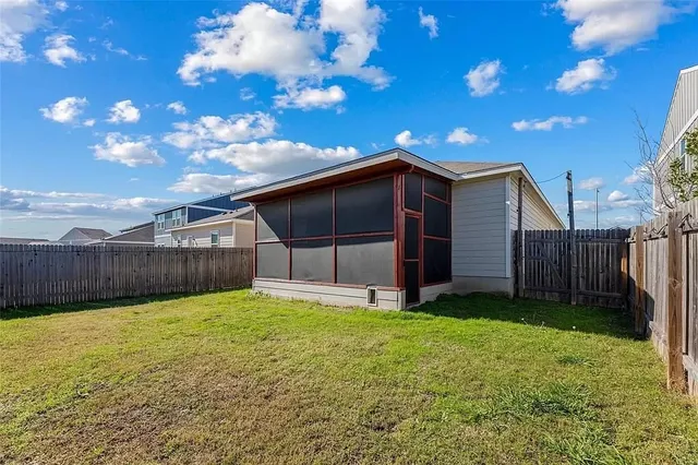 a view of a backyard of the house