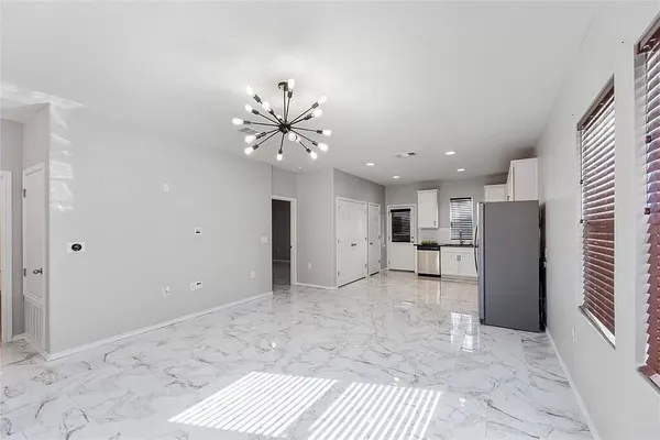 a view of a livingroom with a kitchen