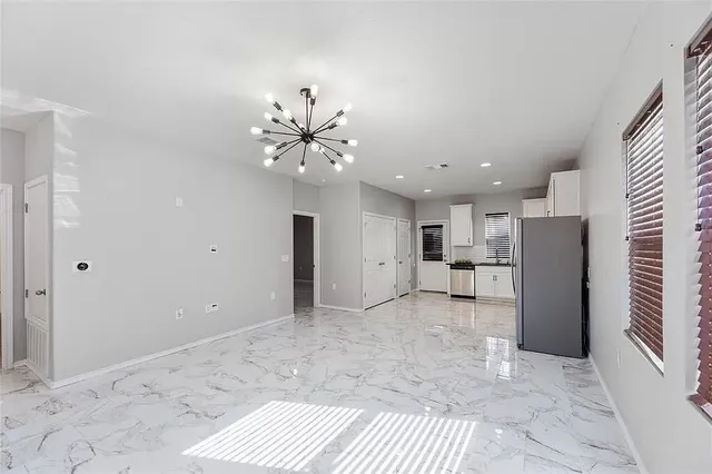a view of a livingroom with a kitchen