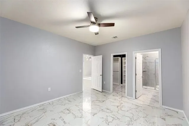 a kitchen with granite countertop cabinets stainless steel appliances and a counter space