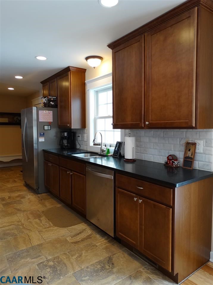 5331 Waterford Road Rixeyville, VA 22737 - Photo 11 of 36 a kitchen with stainless steel appliances granite countertop a sink stove and refrigerator