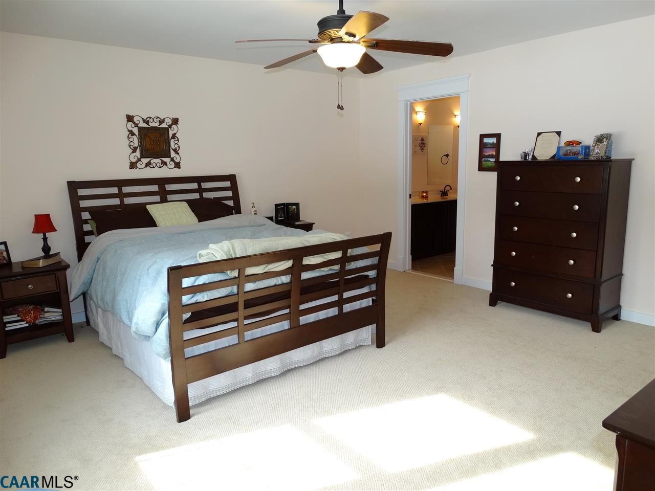 5331 Waterford Road Rixeyville, VA 22737 - Photo 19 of 36 a bed room with a bed and a chandelier