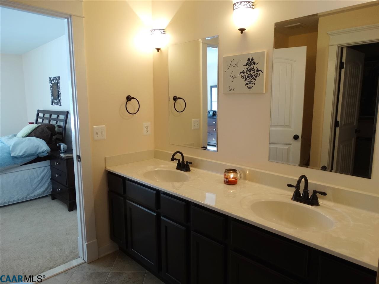 5331 Waterford Road Rixeyville, VA 22737 - Photo 23 of 36 a bathroom with a double vanity sink a mirror and shower