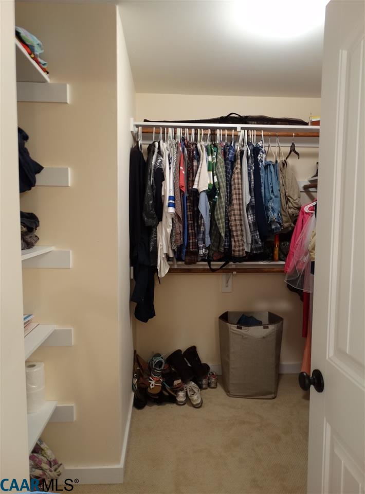 5331 Waterford Road Rixeyville, VA 22737 - Photo 24 of 36 a walk in closet with clothes and shoes