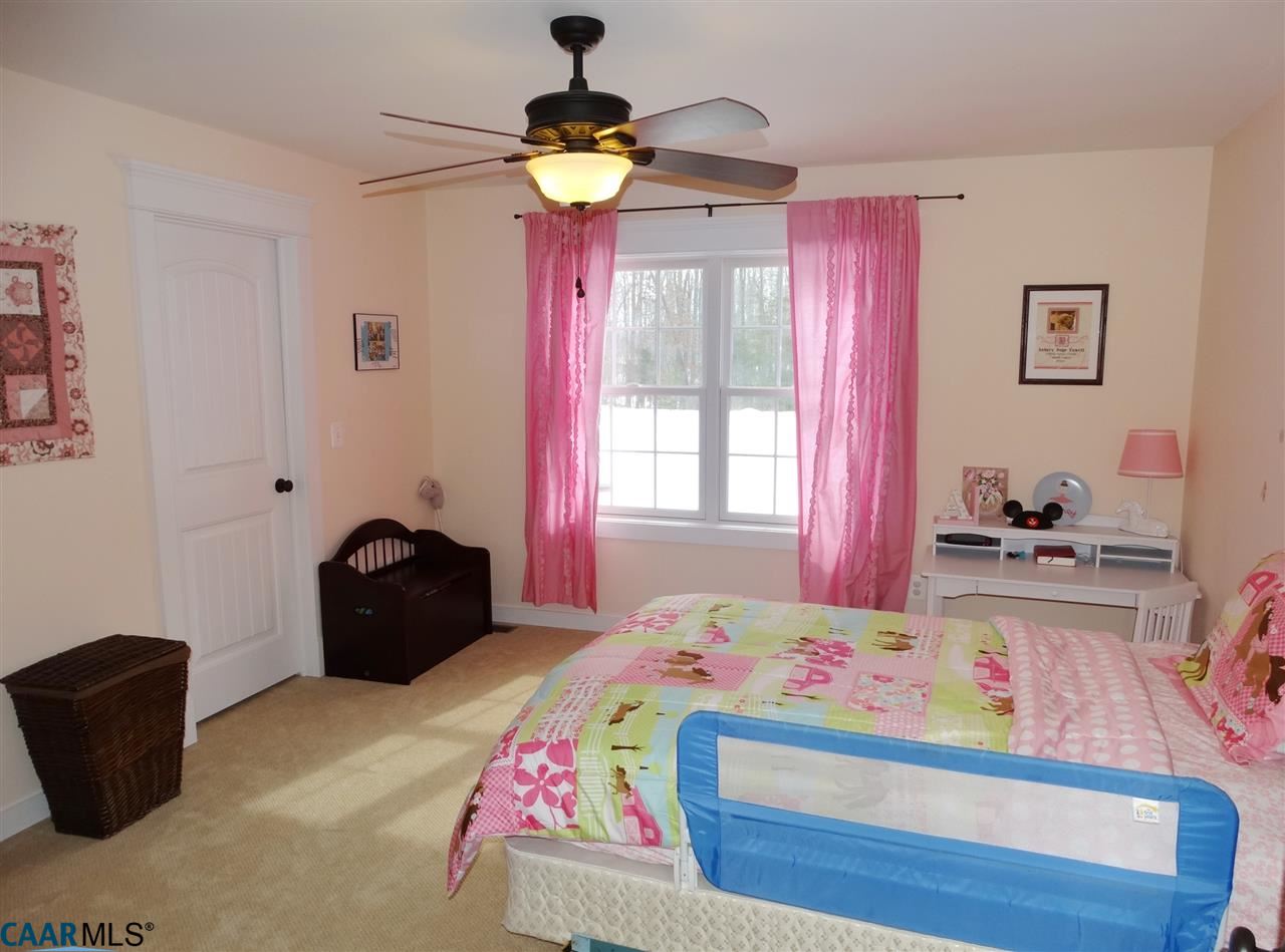5331 Waterford Road Rixeyville, VA 22737 - Photo 26 of 36 a bedroom with a bed and a chandelier