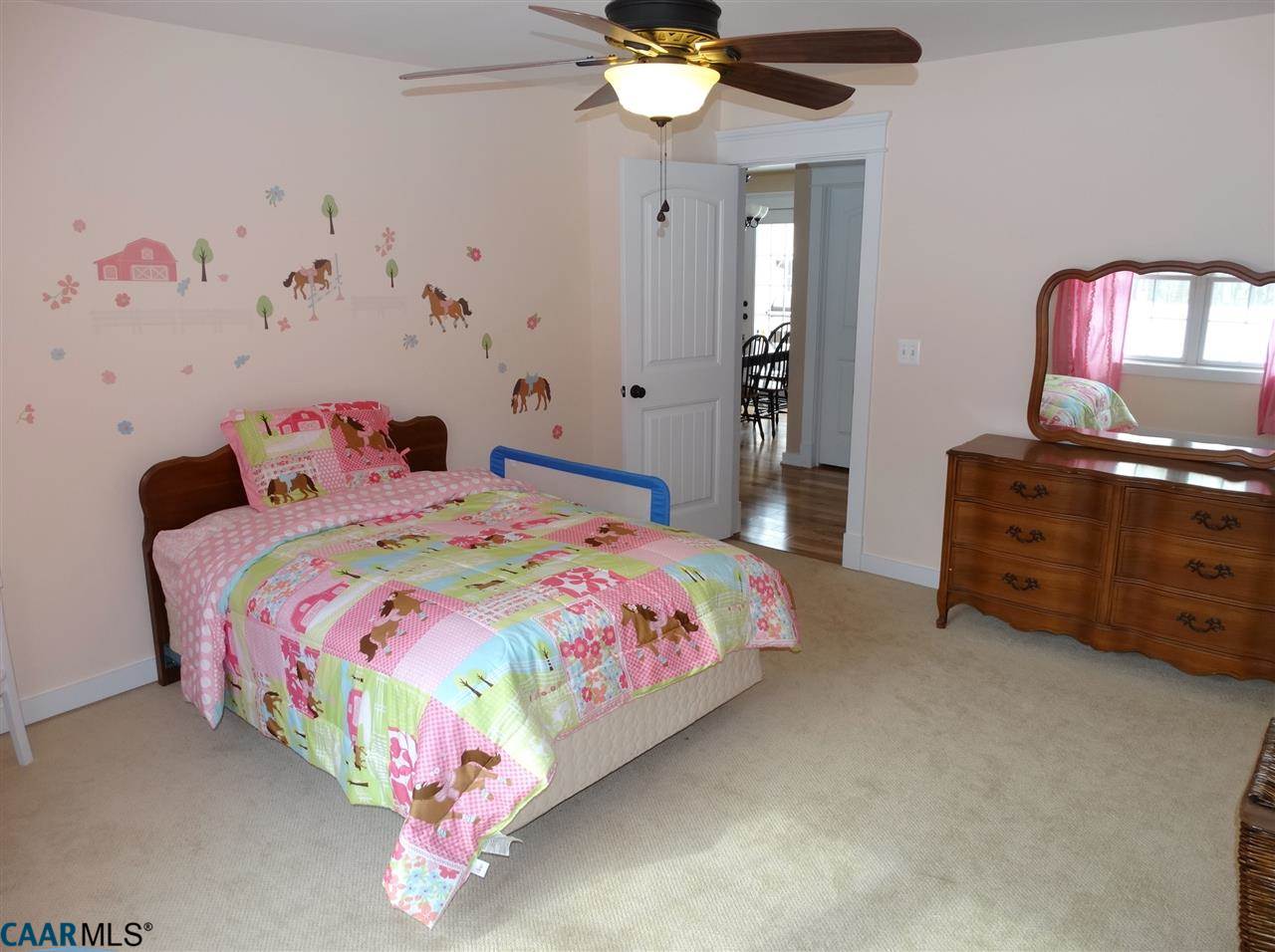 5331 Waterford Road Rixeyville, VA 22737 - Photo 27 of 36 a bedroom with a bed and a chandelier