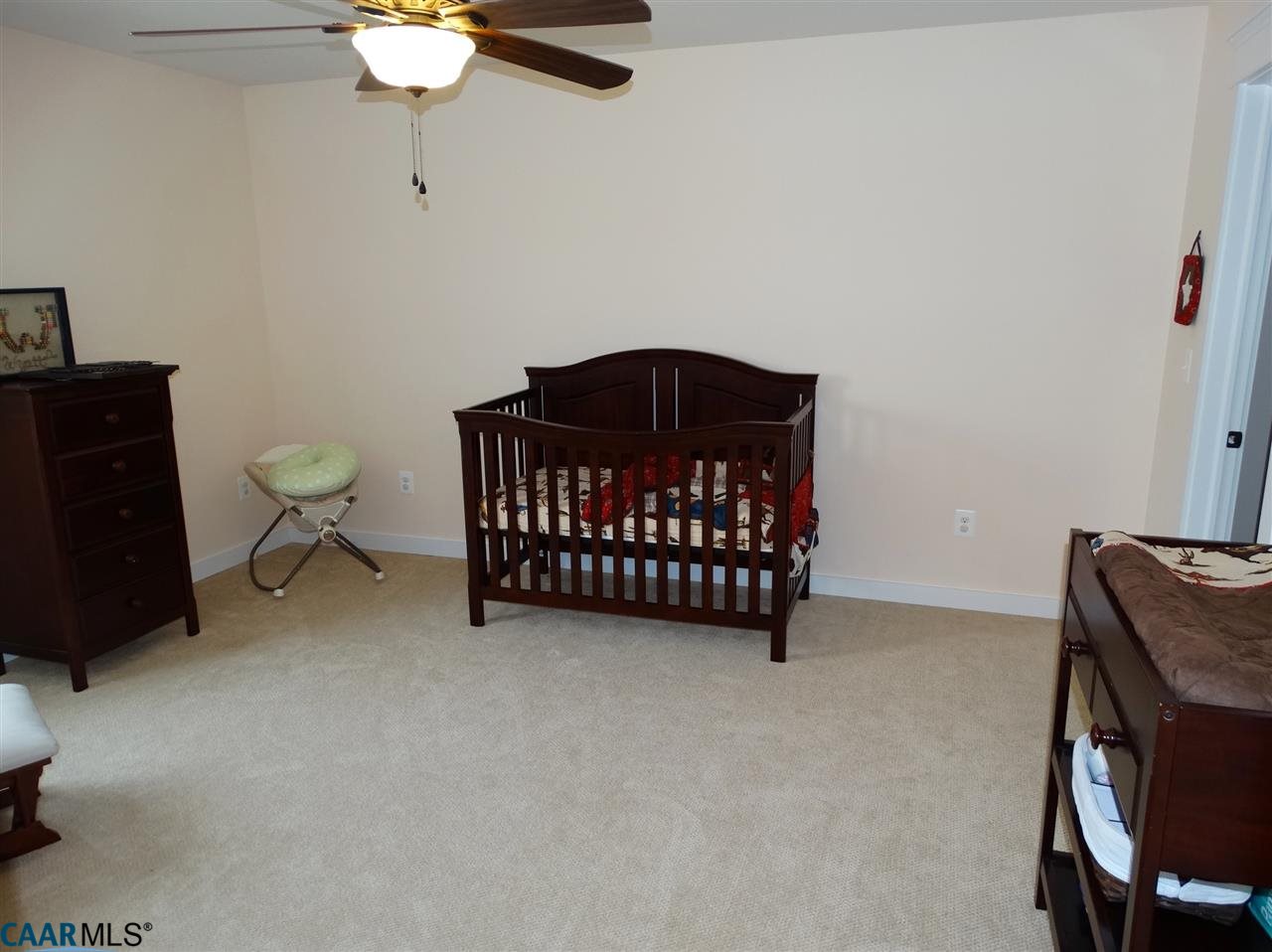 5331 Waterford Road Rixeyville, VA 22737 - Photo 29 of 36 a bedroom with a bed and a chandelier