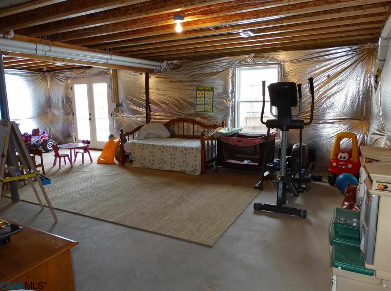 5331 Waterford Road Rixeyville, VA 22737 - Photo 33 of 36 a living room with furniture a window and gym equipment
