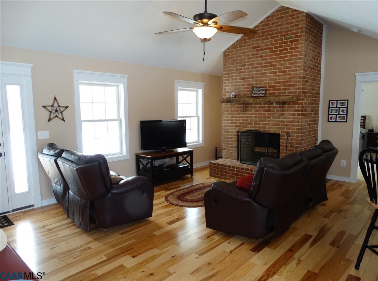 5331 Waterford Road Rixeyville, VA 22737 - Photo 7 of 36 a living room with furniture flat screen tv and a fireplace