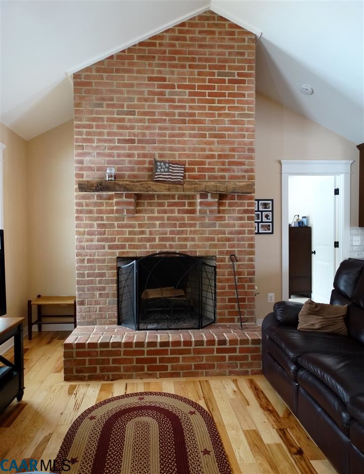 5331 Waterford Road Rixeyville, VA 22737 - Photo 8 of 36 a living room with furniture and a fireplace
