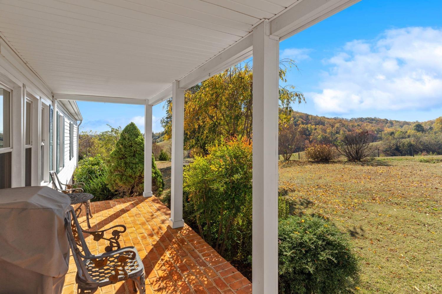 1328 Indian Creek Road Amherst, VA 24521 - Photo 2 of 51 a balcony with next to a yard