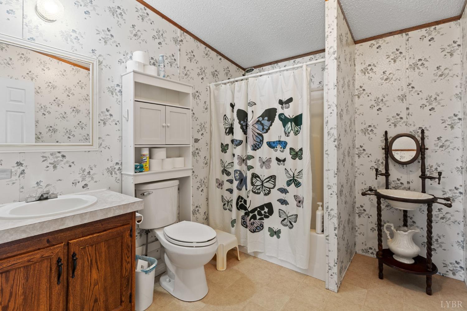 1328 Indian Creek Road Amherst, VA 24521 - Photo 29 of 51 a bathroom with a sink toilet and shower