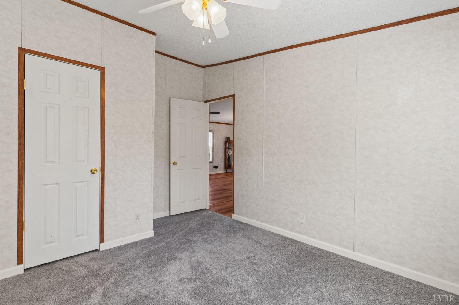 1328 Indian Creek Road Amherst, VA 24521 - Photo 31 of 51 an empty room with a ceiling fan and a window