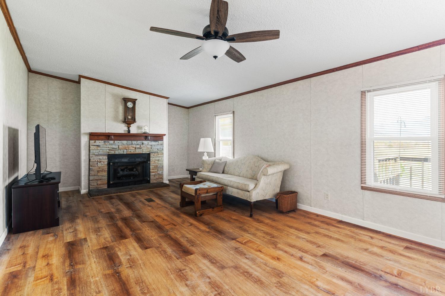 1328 Indian Creek Road Amherst, VA 24521 - Photo 8 of 51 a living room with furniture and a fireplace