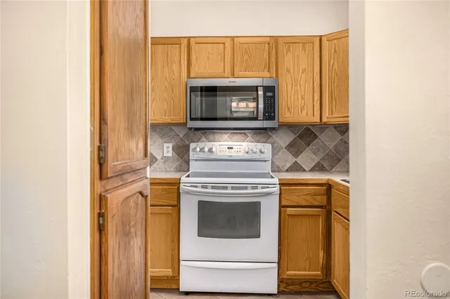 a kitchen with a stove and a microwave