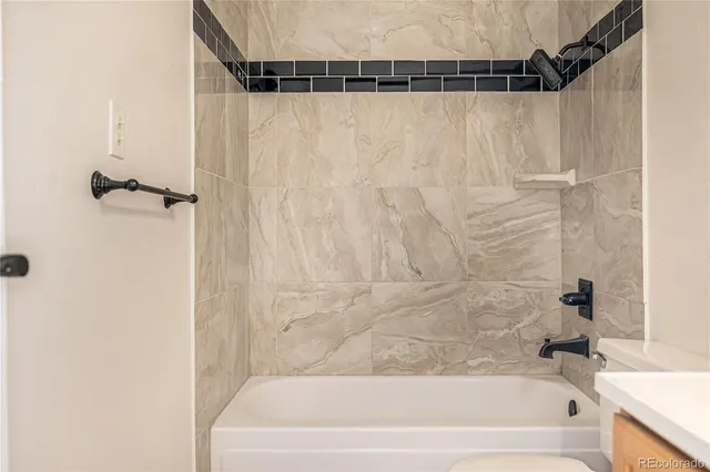 a bathroom with a shower and a bathtub