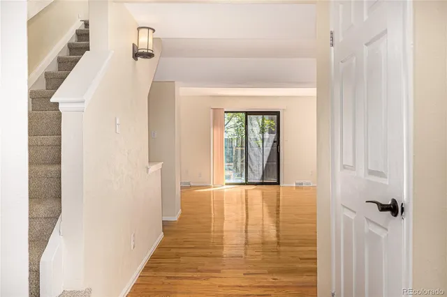 a view of a hallway with a white walls