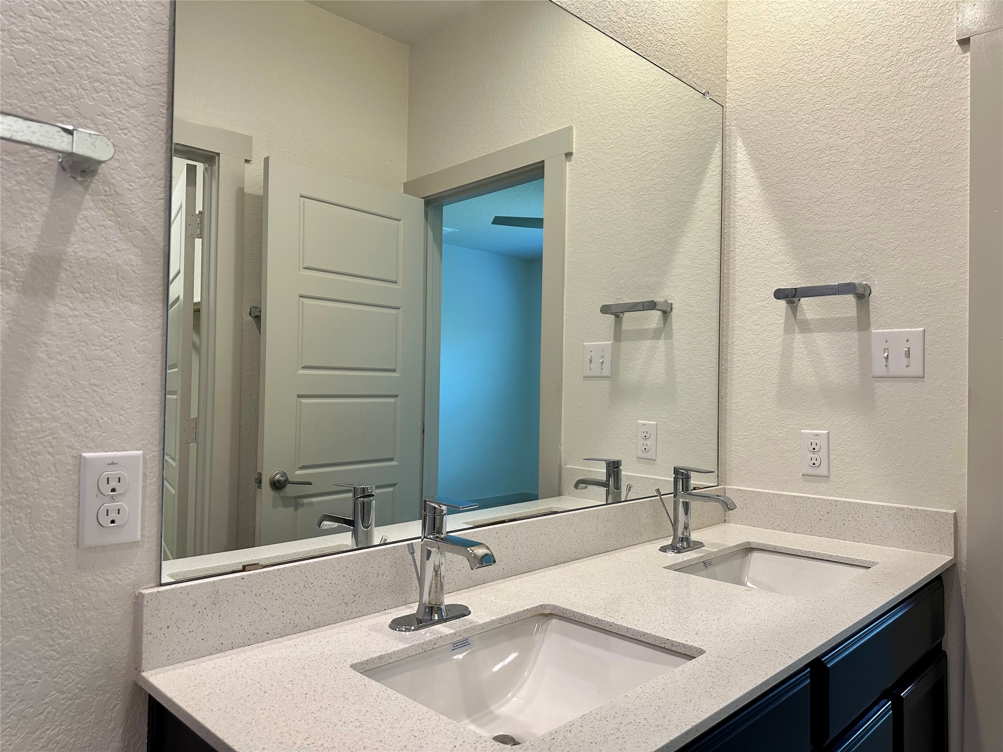 5132 Vanner Path Georgetown, TX 78626 - Photo 15 of 37 Bathroom with a textured wall and double vanity