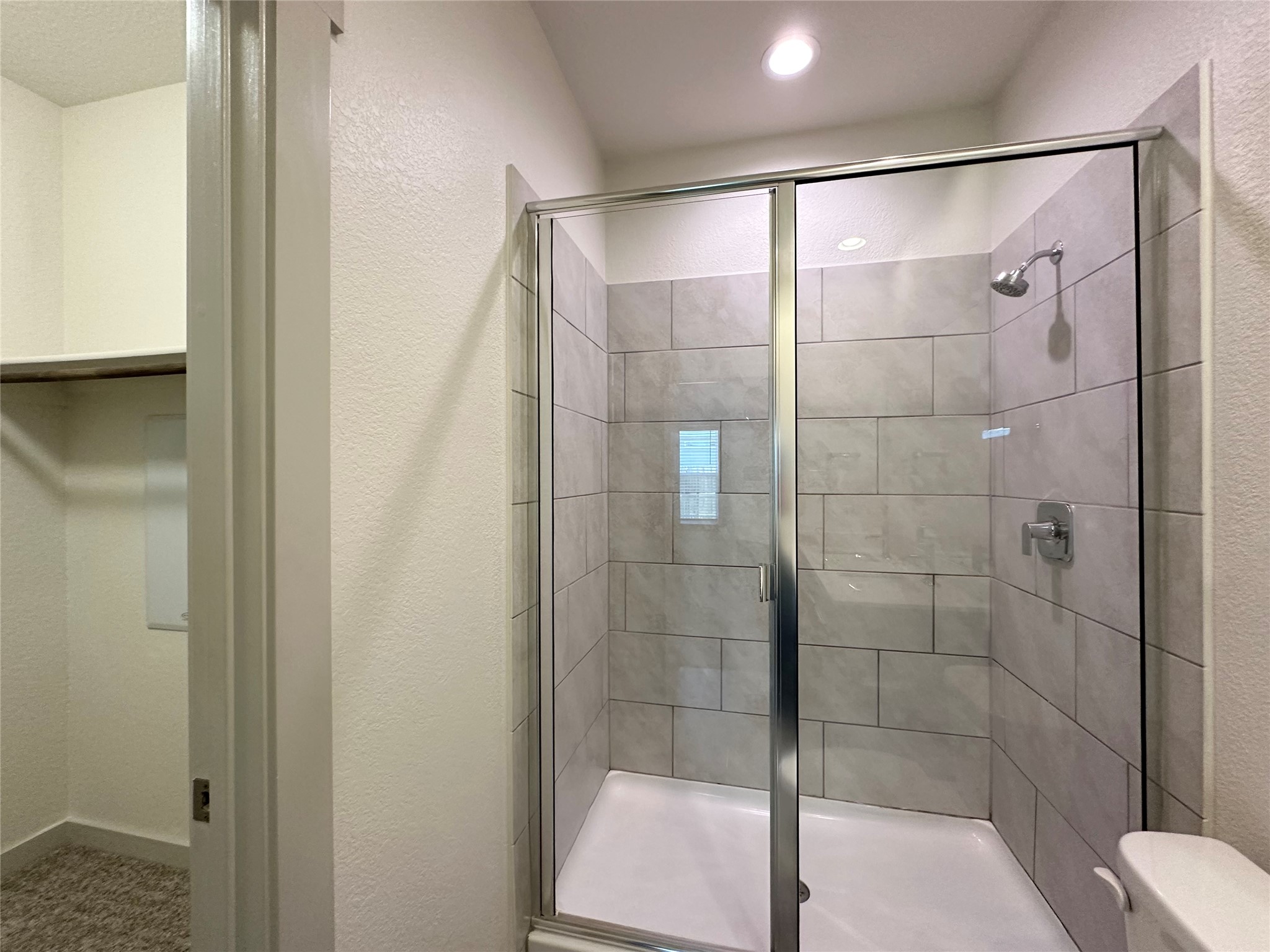 5132 Vanner Path Georgetown, TX 78626 - Photo 16 of 37 Full bath featuring a textured wall and a stall shower