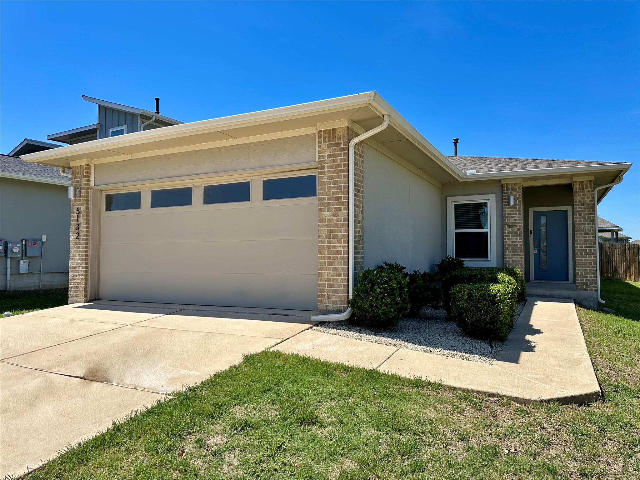 5132 Vanner Path Georgetown, TX 78626 - Photo 3 of 37 View of front of property featuring brick siding, a garage, and concrete driveway