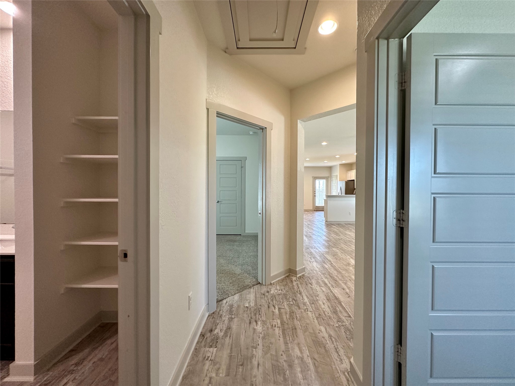 5132 Vanner Path Georgetown, TX 78626 - Photo 30 of 37 Hall featuring light wood-style flooring and recessed lighting