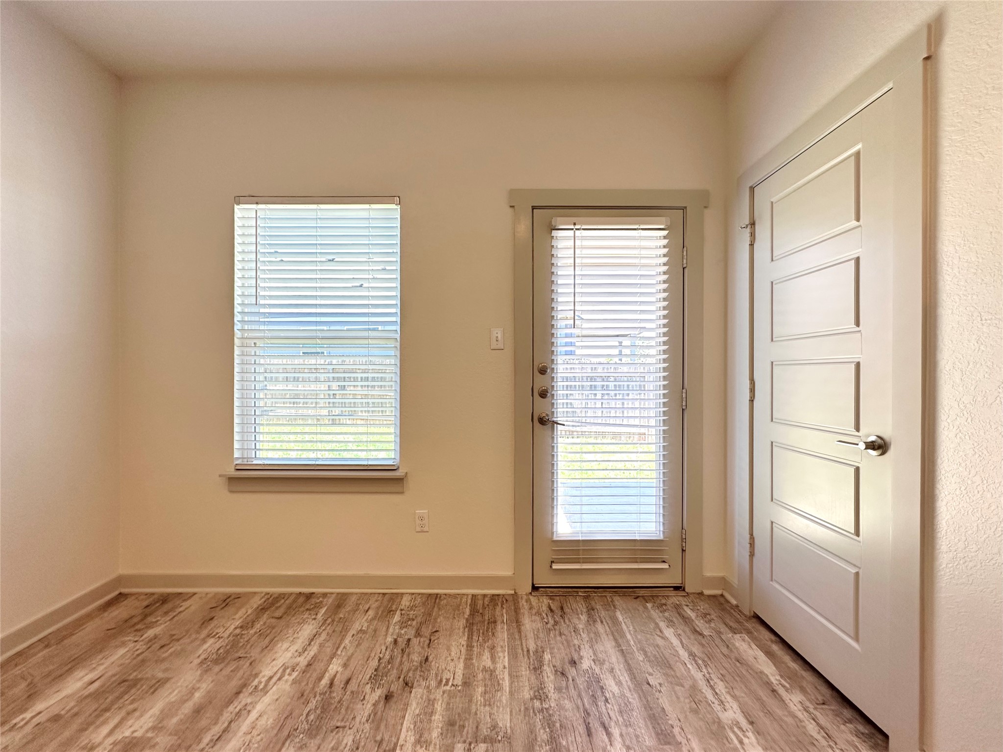 5132 Vanner Path Georgetown, TX 78626 - Photo 32 of 37 Doorway featuring wood finished floors and baseboards