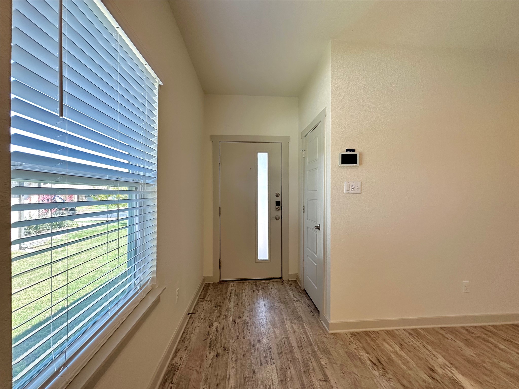 5132 Vanner Path Georgetown, TX 78626 - Photo 7 of 37 Foyer featuring light wood-type flooring and baseboards