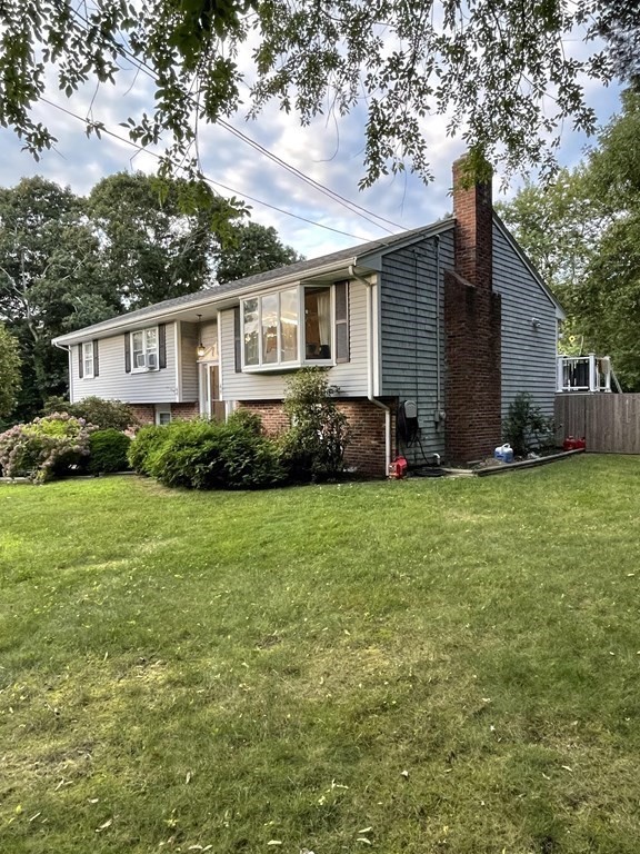 12 Tecumseh Road Bourne, MA 02562 - Photo 1 of 36 a front view of house with yard and green space