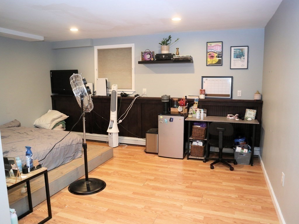 12 Tecumseh Road Bourne, MA 02562 - Photo 17 of 36 a living room with furniture a flat screen tv and window